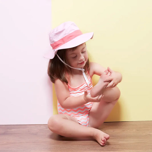 chapeau antiuv rose portée par fille