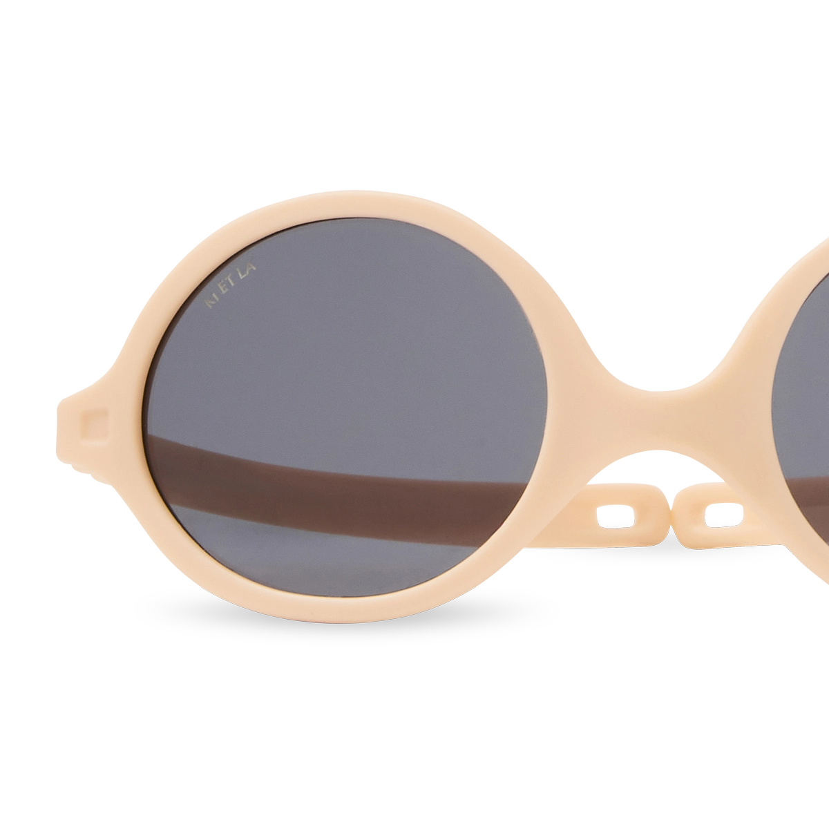 packshot lunettes de soleil bébé diabola abricot